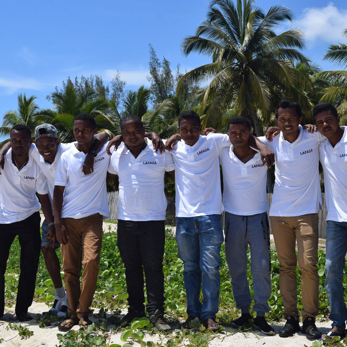 LAFAZA team standing in front of tropical background