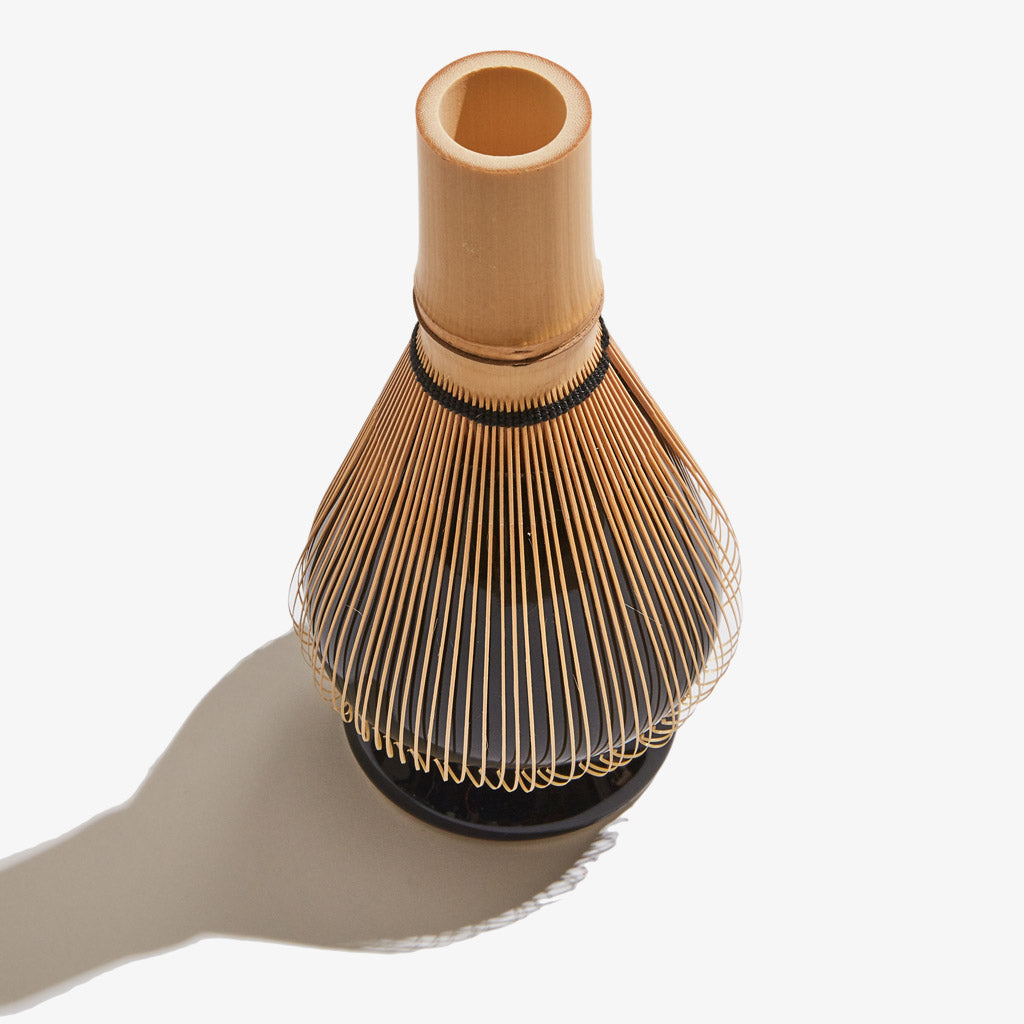 Celadon matcha whisk holder with bamboo whisk on top