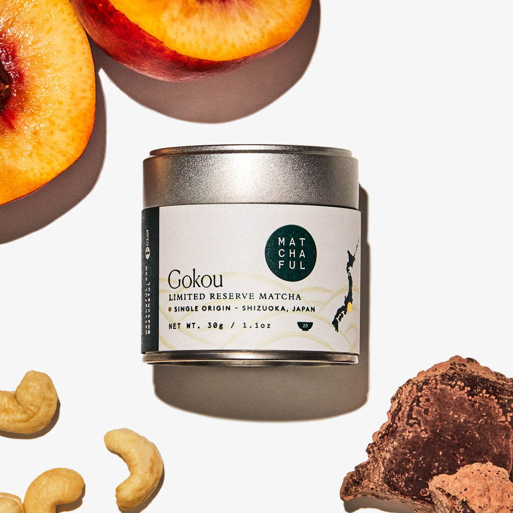 30g tin of Gokou Limited Reserve Single Origin Ceremonial Matcha surrounded by tasting note flavors of nectarine, cashews, and cacao