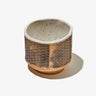 Natural clay exterior and white glazed interior ceramic matcha tea bowl with a Seigaiha pattern on the exterior