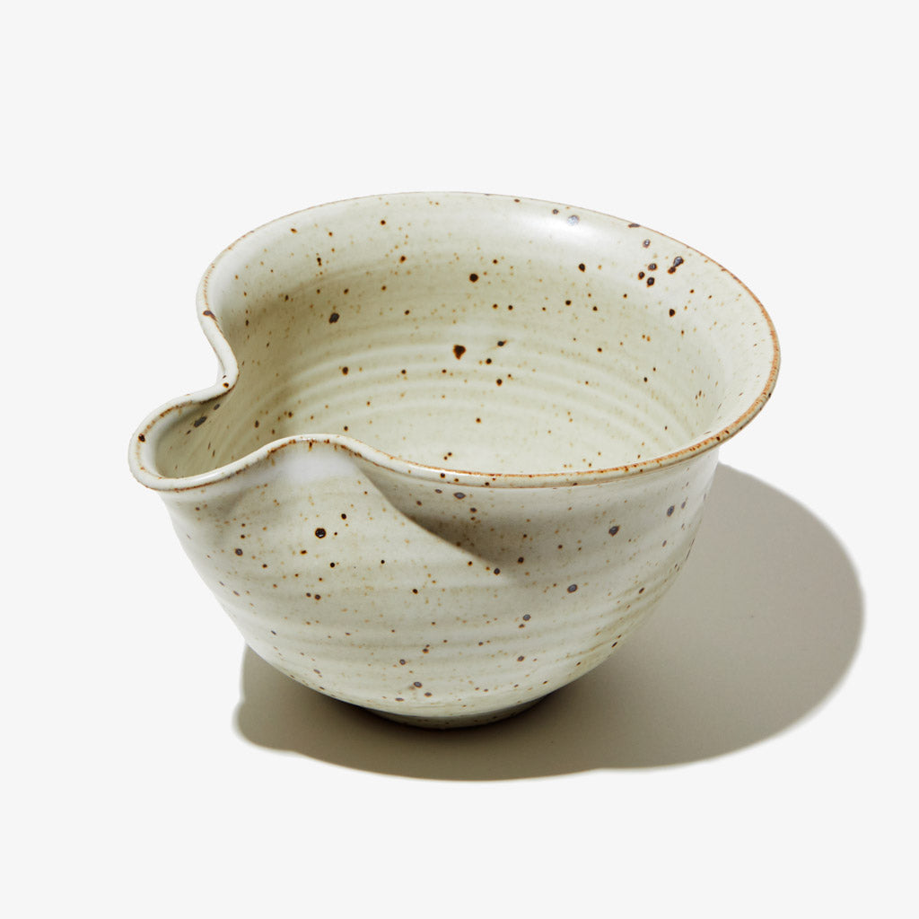 White ceramic matcha whisking bowl with natural speckling